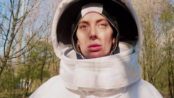 Portrait of female astronaut standing in nature