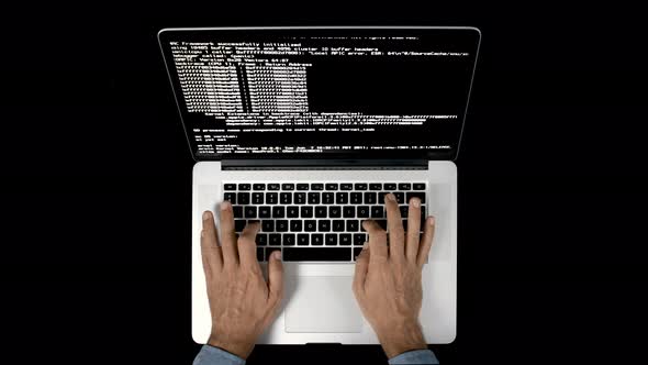 Video of Person Using Laptop with Data Code on Screen