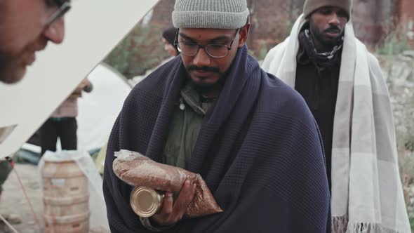 Volunteers Providing Food to Immigrants