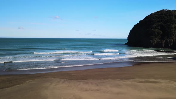 Right hand surf break at Te Waha point in Piha