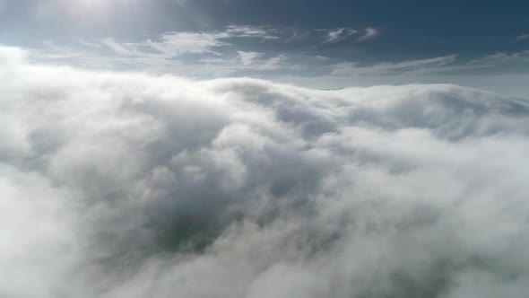  Drone Footage of Sunny Skyline. Flying Over the Thick Clouds During the Sunset