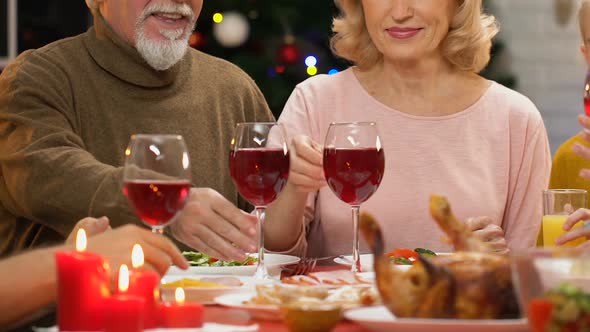 Family Raising Toast at Christmas Dinner, Tradition to Get Together for Holidays