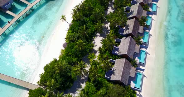 Beautiful overhead copy space shot of a paradise sunny white sand beach and blue water background