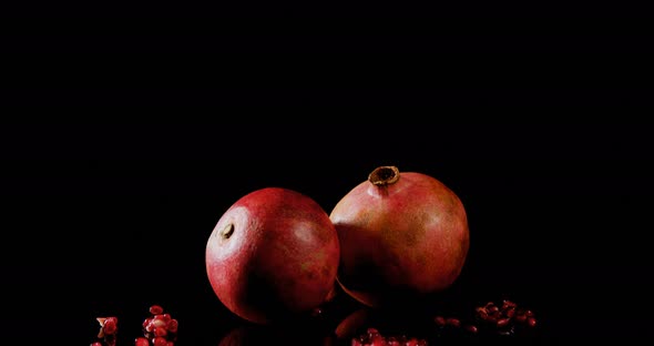 Pomegranate on black background 4k