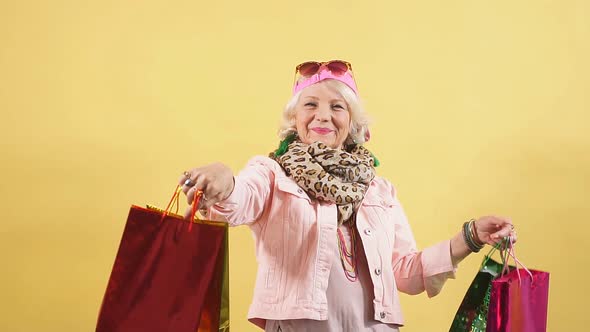 Smiling Stylish Old Lady Doing the Shopping. Granny Enjoying Shopping Day