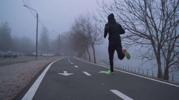 Man running on a bike lane