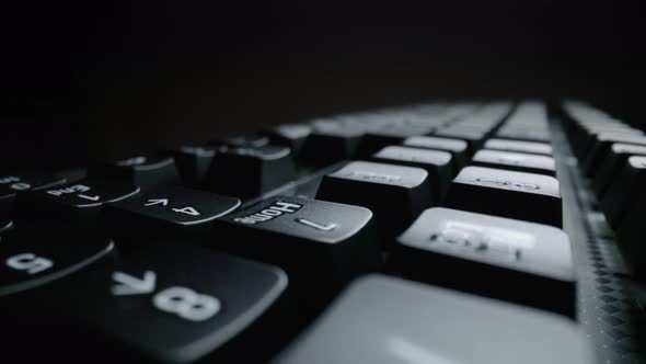 Close-up view of computer keyboard. Macro soft focus dolly shot