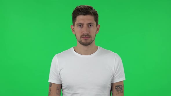 Portrait of Confident Guy Is Looking Straight. Green Screen
