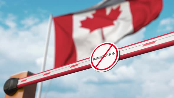 Opening Barrier with Stop Immigration Sign at the Canadian Flag