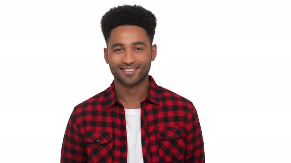 Portrait of Happy Glad Darkskinned Guy in Red Plaid Shirt Looking on Camera Smiling Broadly with