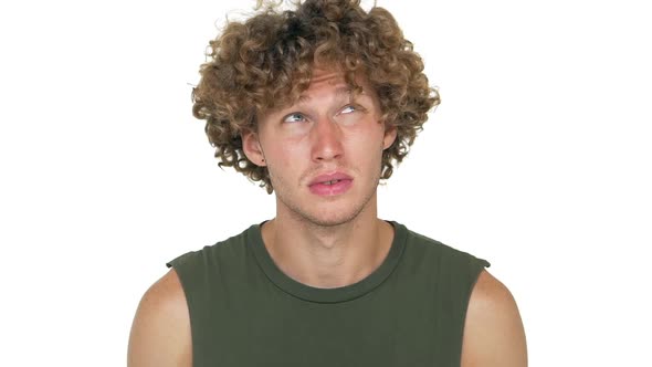 Slomo Portrait of Upsep Curly Man in Green Muscle Shirt Looking on Camera Thoughtfully Shaking Head