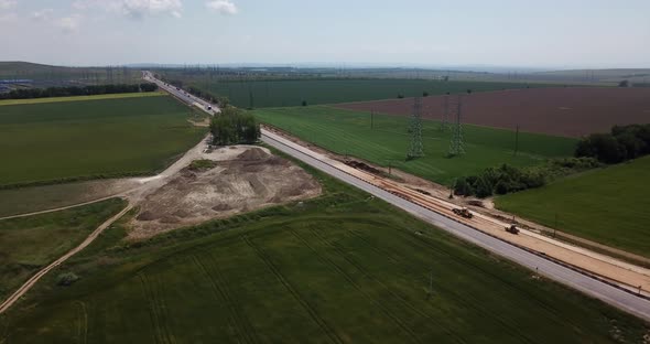 Road Construction Site with Machinery, Bulldozer, Excavation From Above.  Video, Aerial View