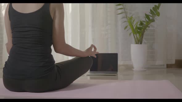 Woman teaching yoga online first step is meditation zen for working out