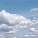 White Puffy Clouds Drifting Across Blue Sky in Time Lapse - VideoHive Item for Sale