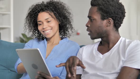 African Couple Using Tablet