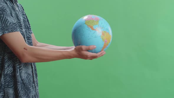 Side View Of A Man In Front Of Green Screen Background Extend The World Globe High