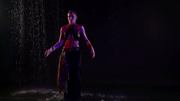 Amazing Belly Dance Under Rain in Darkness Young Sexy Woman is Dancing Alone Female Silhouette