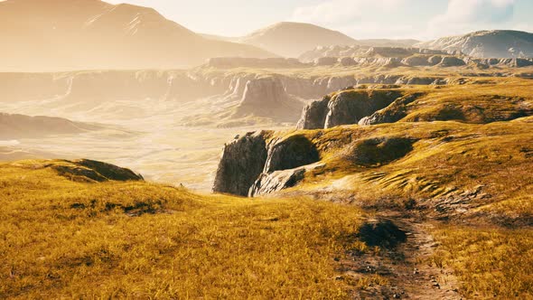 Landscape with Mountains and Dry Yellow Grass in New Zealand