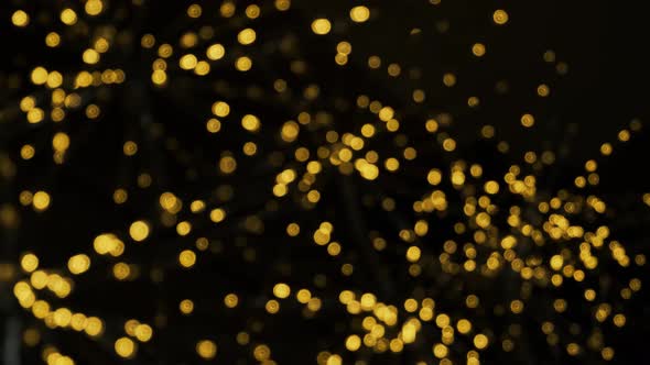 Blurred Bokeh Christmas Illuminations. Abstract Particles Background