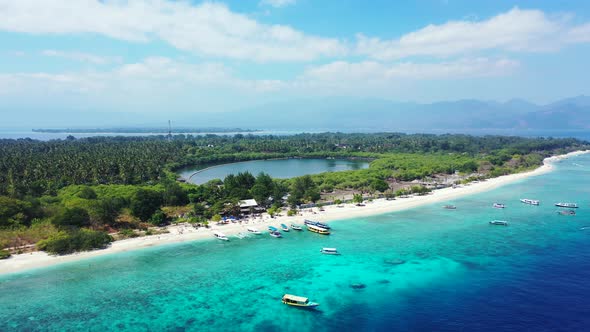 Tropical birds eye island view of a sandy white paradise beach and blue water background in hi res 4