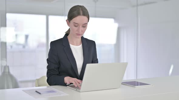 Young Businesswoman Standing Up and Going Away