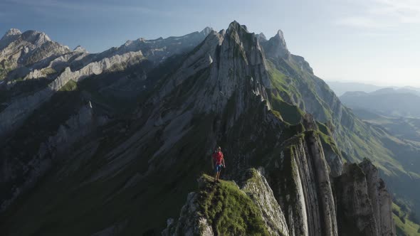 Aerial view of a person hiking on the mountain top, Wasserauen, Switzerland.