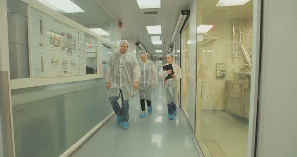 Scientists walking in halls of a pharmaceutical lab