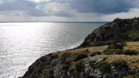 Drone flying forward over som cliffs at Kullaberg summertime