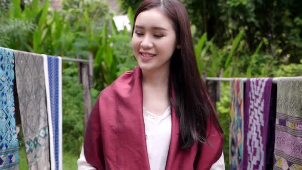 Woman Walking And Smiling  With Traditional Laos Fabrics Patterns