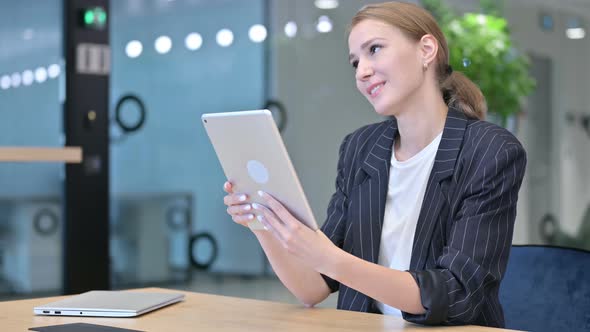 Professional Businesswoman Doing Video Call on Tablet 