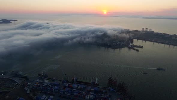 Drone View of the City and Port Located on the Peninsula at Sunset