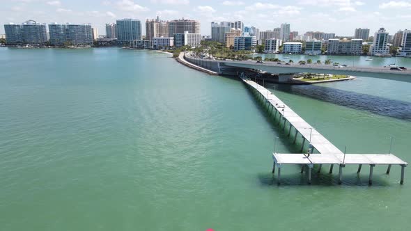A new Sarasota, Florida fishing pier. A speedy backward aerial of the Sarasota park near the John Ri