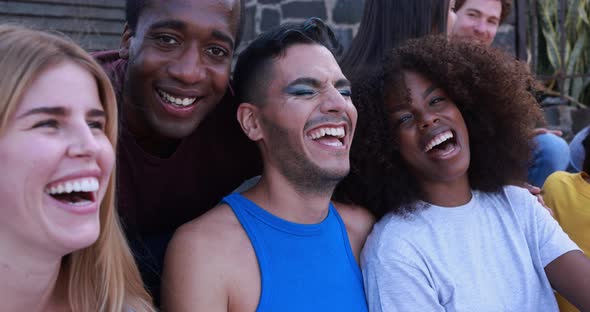 Young diverse people having fun outdoor laughing together - Diversity concept