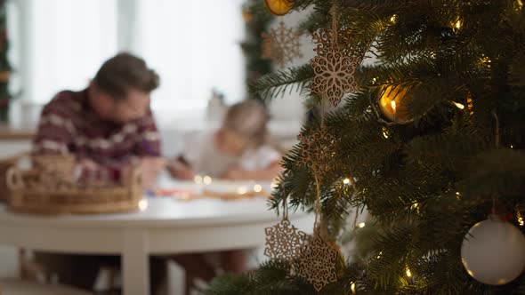 Writing letter to Santa Claus by cute little girl with daddy. Shot with RED helium camera in 8K