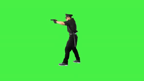 Young Caucasian Policeman Appears Makes a Shoot and Walks Away on a Green Screen Chroma Key