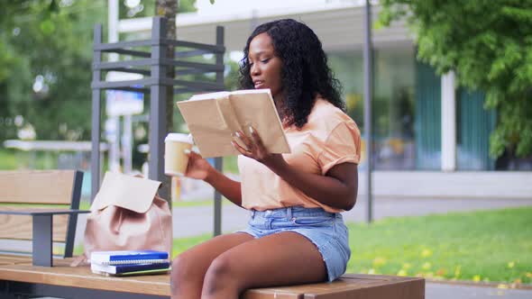 Student Girl Reading Book and Drinking Coffee