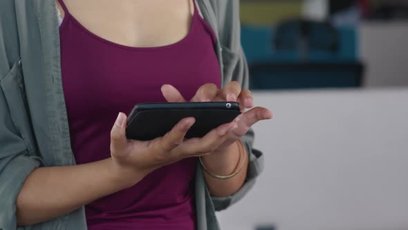 Young African Woman in Modern Office Business Woman Uses the Tablet