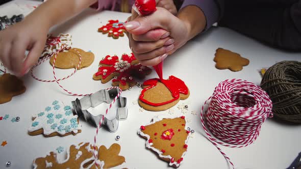 Decorating of Christmas gingerbread cookies