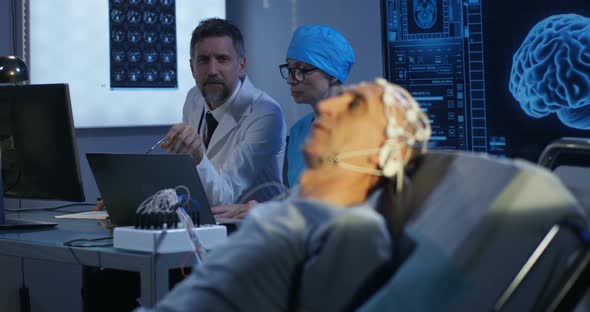 Patient Lying in Bed During EEG Examination