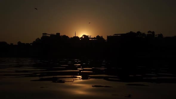 Sunset View in Udaipur City Palace. Reflection of sunlight falling on Lake