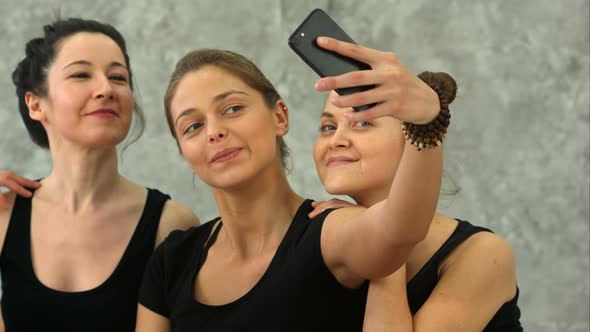 Three Young Women Making Selfie After Workout at Yoga Class