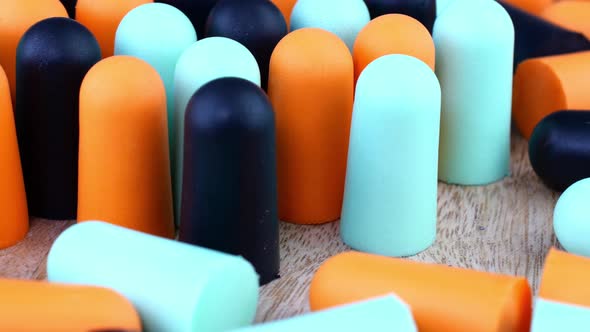 Heap Many Soft Orange Blue and Black Earplugs Protect Against Loud Noise and Help Sleep Peacefully