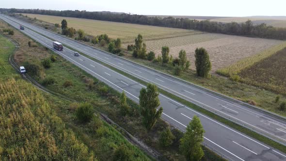 Aerial View of a Truck and Other Traffic Moving Along a Freeway