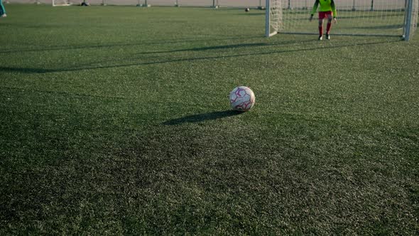 Young Goalkeeper Resists Friend Attack Falling on Knees