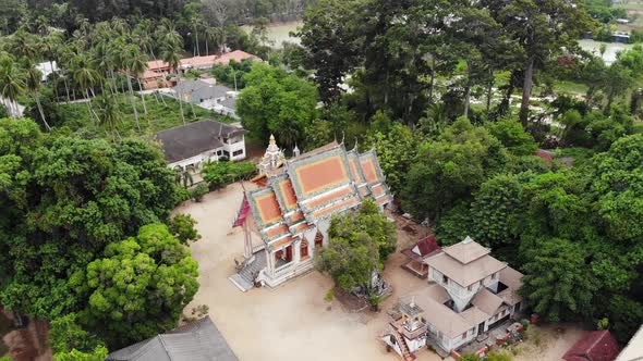 Classic Buddhist Temple Between Forest. From Above Drone View Classic Buddhist Monastery Between