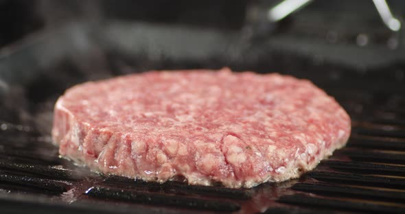 Raw Beef Burger Is Fried with Hot Steam