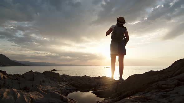 Contemplative Young Travel Woman Looking on Wonderful Nature Sky and Sea at Sunset Back View