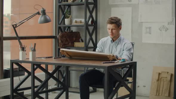 Concept Architectsengineer Holding Pen Pointing Equipment Architects On the Desk with a Blueprint in