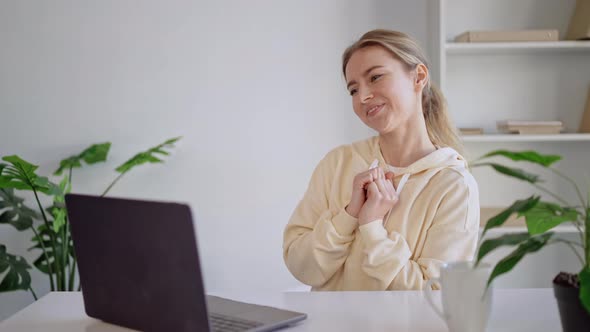 Smiling Blonde Use Webcam for Conversation