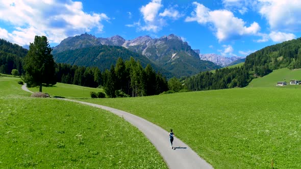 Woman Jogging Outdoors Italy Dolomites Alps